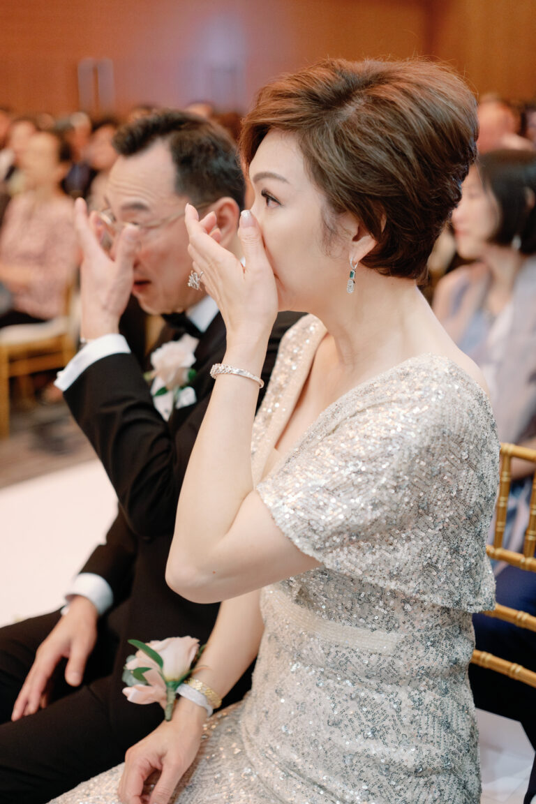 An emotional moment during an outdoor wedding ceremony