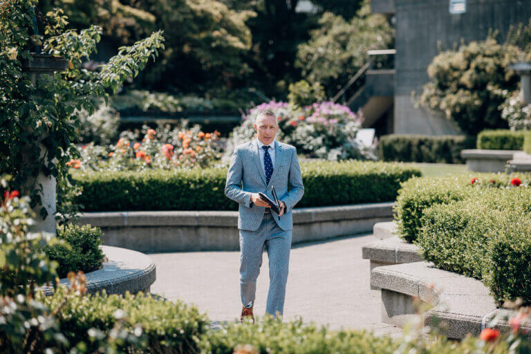 Jonathan Evans officiating UBC Rose Garden's a rose garden ceremony