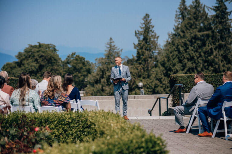 Jonathan Evans officiating UBC Rose Garden's a rose garden ceremony