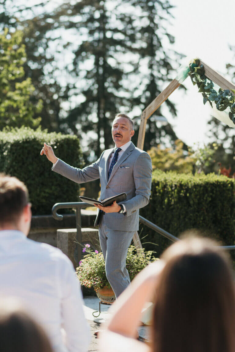 Jonathan Evans officiating a couple's ceremony