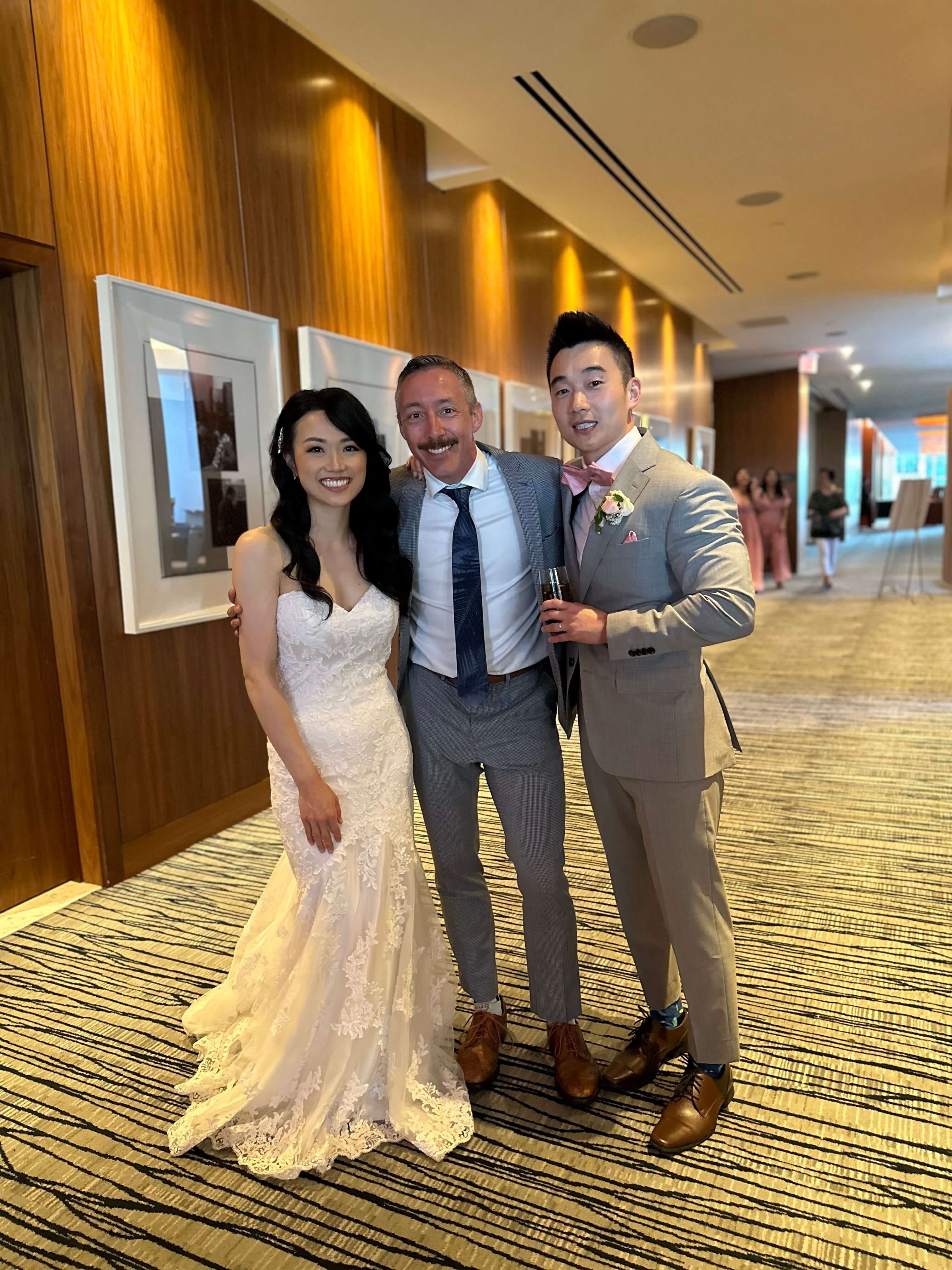 Jonathan Evans with Nora and Jason on their wedding day