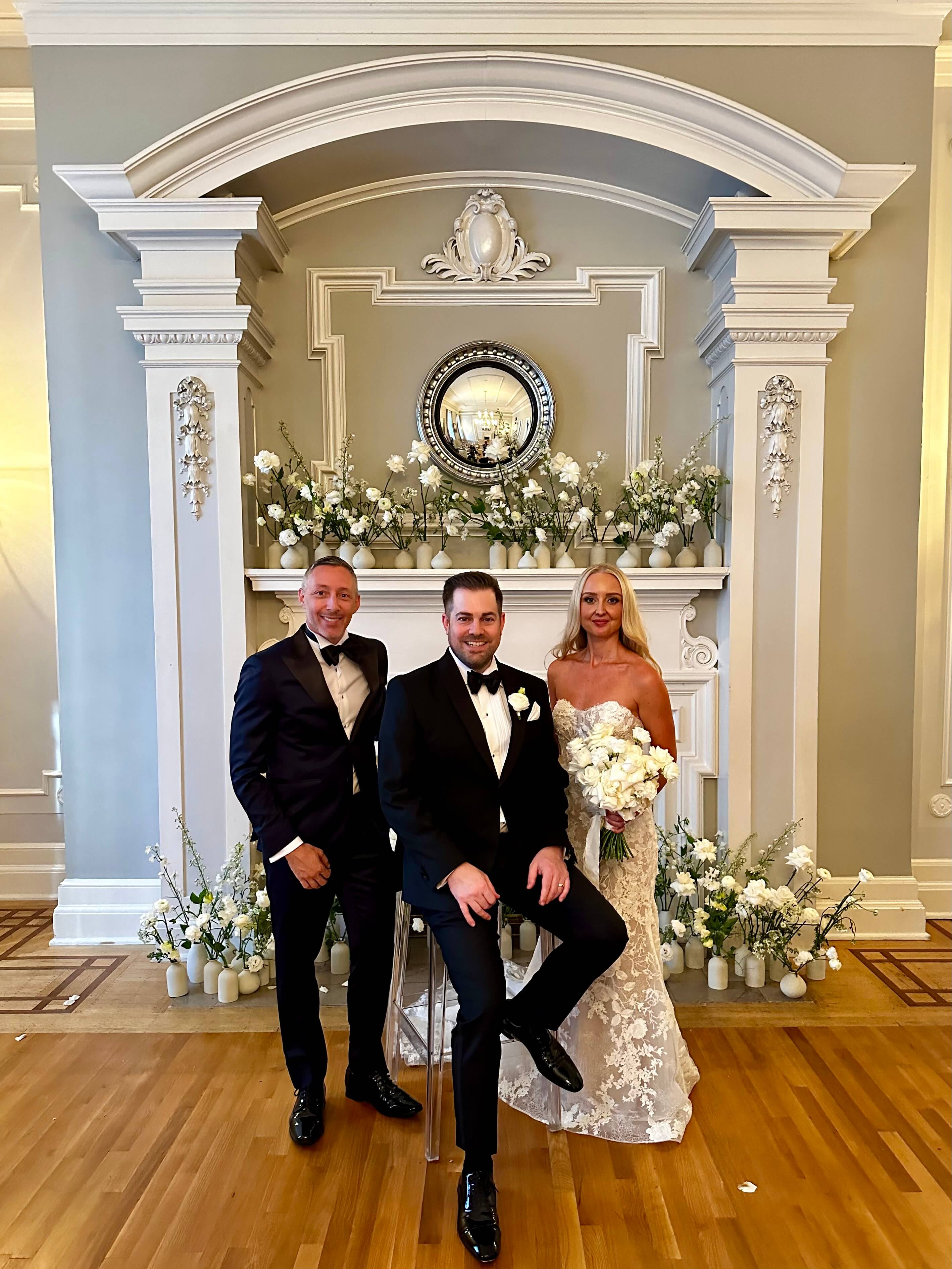 Jonathan Evans with Jessica and Matt on their wedding day