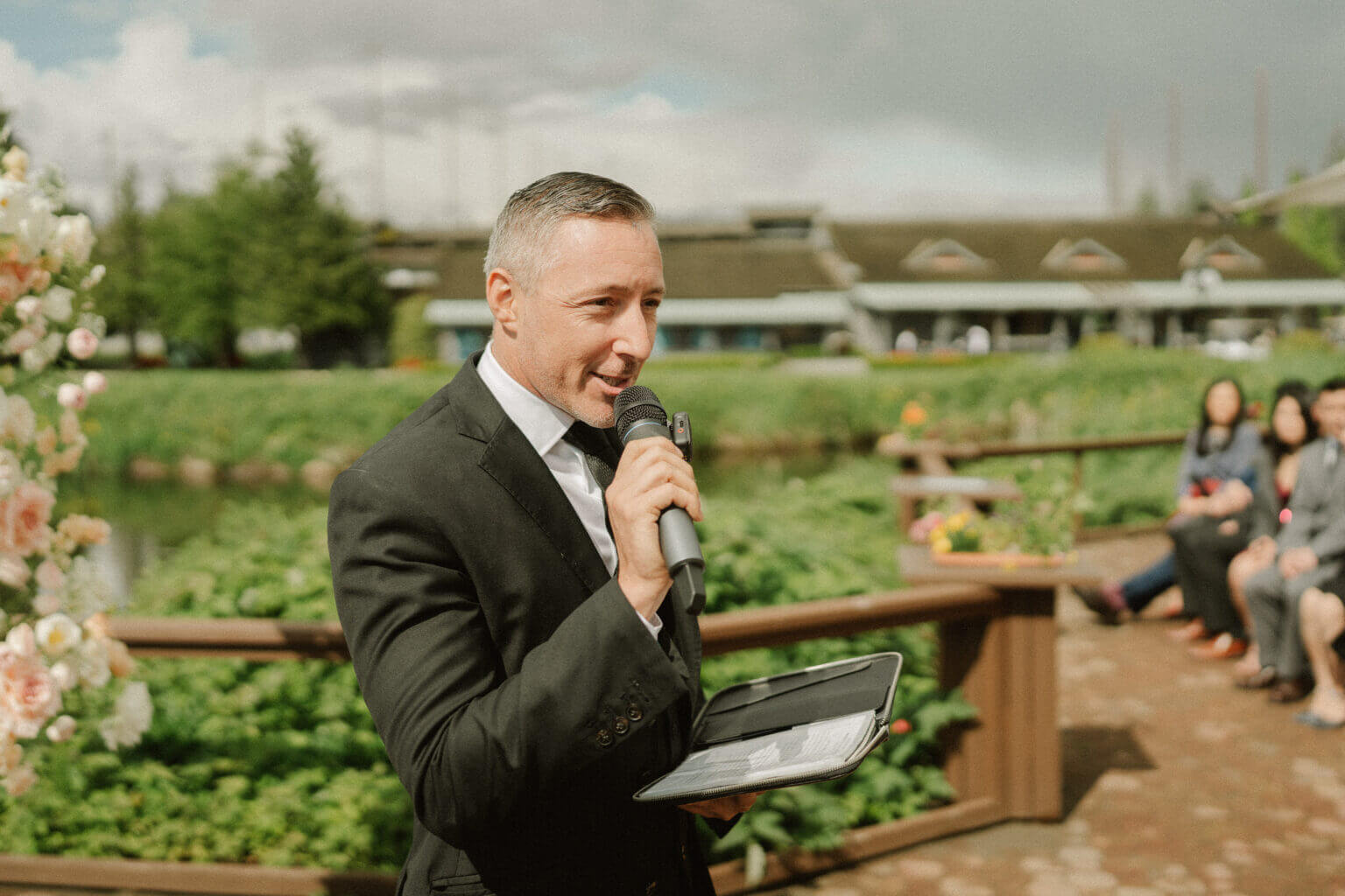 Jonathan Evans officiating an outdoor wedding ceremony